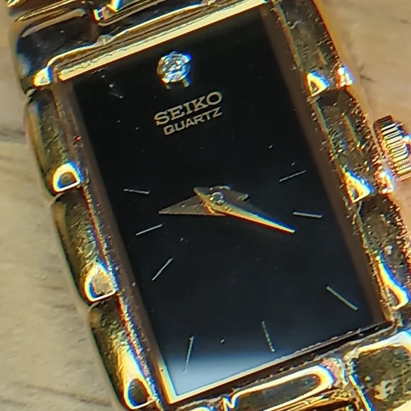 Seiko Ladies Black dial, 2 hand movement gold case and bracelet w/diamond at 12 - Picture 9 of 10